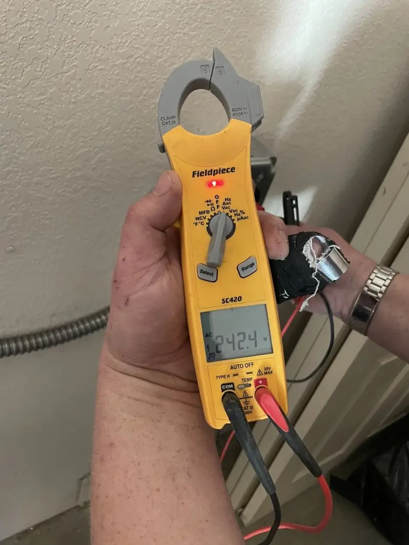 Voltage testing with clamp meter during Ceiling Fan Installation in Park Rapids